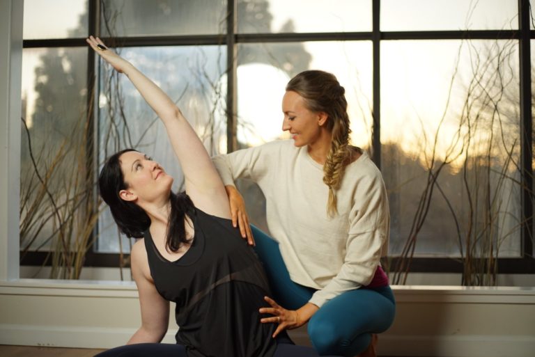 brett larkin and kristin leal in a yoga anatomy demonstration for advanced yoga training