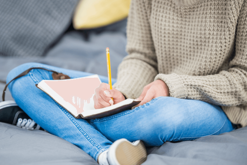 woman writing in journal