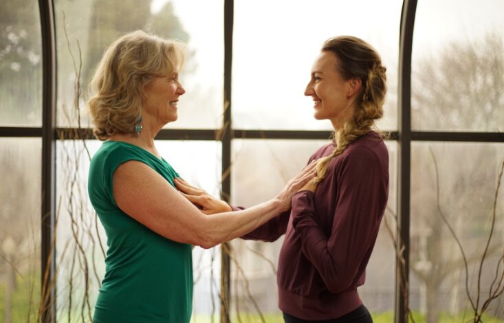 advanced chakra studies in uplifted 300 hour yoga certification - brett and anodea with hands on hearts