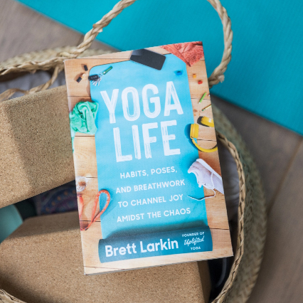 Brett Larkin leading a yoga class as an E-RYT 500 registered yoga teacher