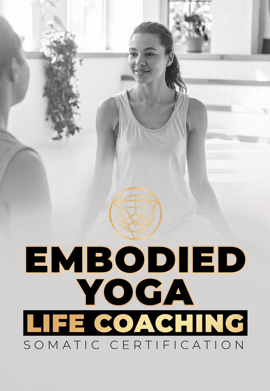 Woman seated in a yoga studio during a life coaching session, promoting the Embodied Yoga Life Coaching Somatic Certification program.