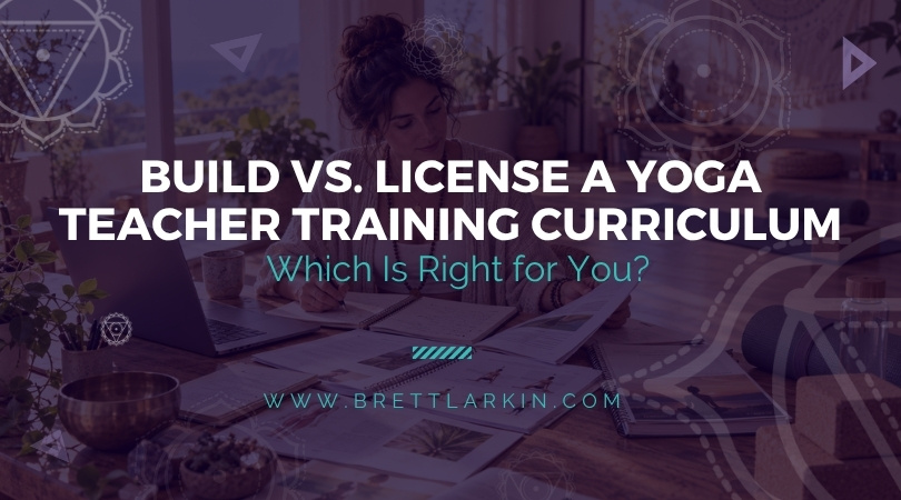 Build vs. license a yoga teacher training curriculum, with a yoga teacher creating course materials at her desk.